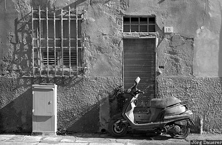 Motorino in Pisa Motorino in Pisa, Italy, Pisa, Tuscany, alley, black and white, door, gate, moped, motorino