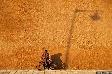 Shadow and wall Doukkala-Abda, El Jadida, Morocco, bicycle, evening light, man, shadow