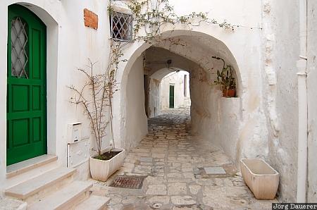 Alley in Ostuni Italy, Apulia, Ostuni, citta bianca, arc, white, cobblestone pavement
